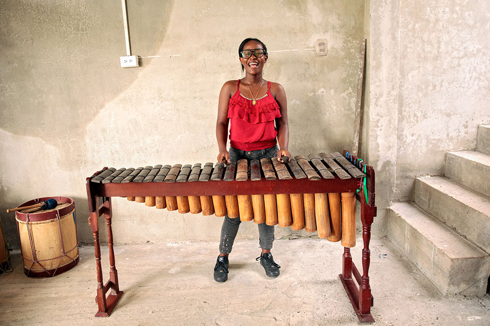 Mila Rodriguez playing a Marimba. Photo: UN Women/Ryan Brown