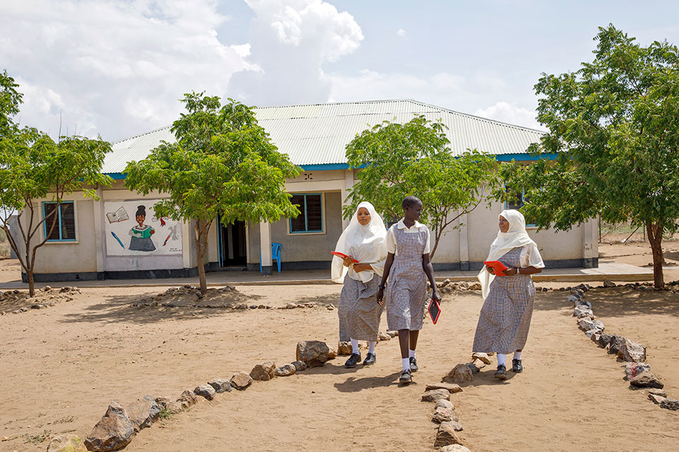 (L-R): Students Umohoza Hurlarain, Nyamam Gai Gatluak, and Mumina Khalif on the grounds of the Angelina Jolie Primary School.  